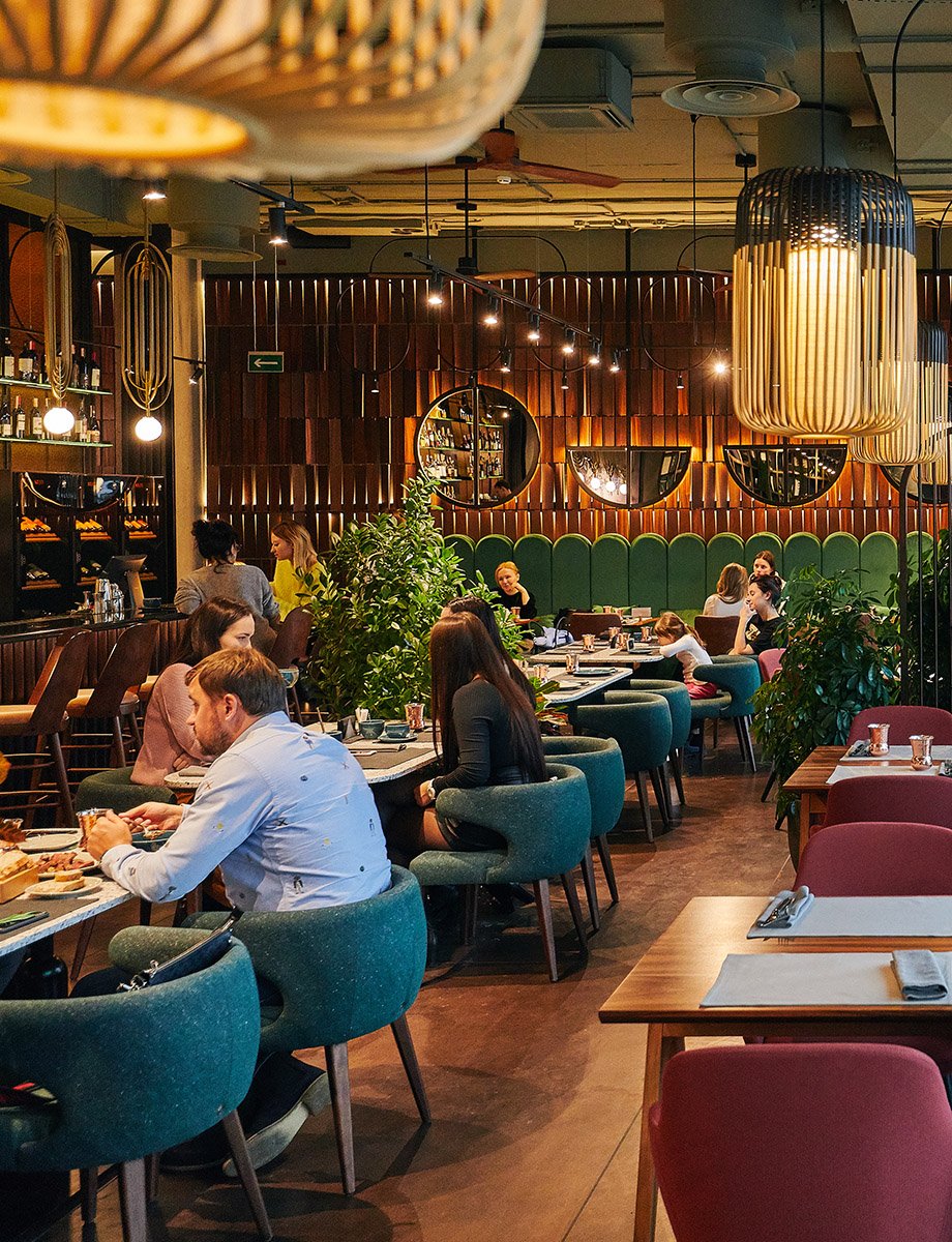 a restaurant with people and waiters, with large windows, the interior in a modern beautiful style